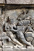 Prambanan - Ramayana reliefs of Shiva Temple. Detail of the panel of the rape of Sita by Rawana, disguised as a begging Brahman.  